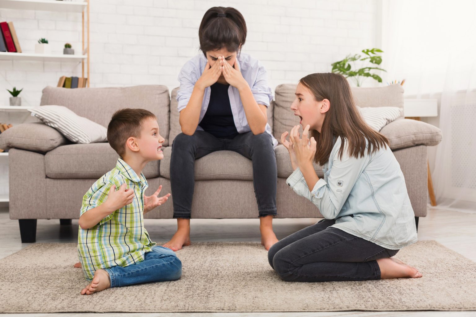 Mom is depressed by screaming children, siblings having
